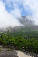 fifth station on mount fuji, view on the top with some clouds, japan