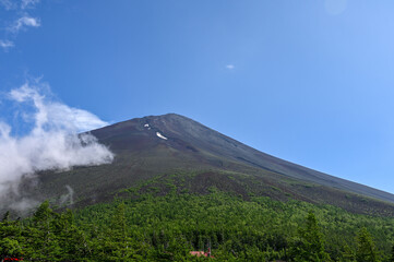 fifth station on mount fuji, view on the top with some clouds, japan