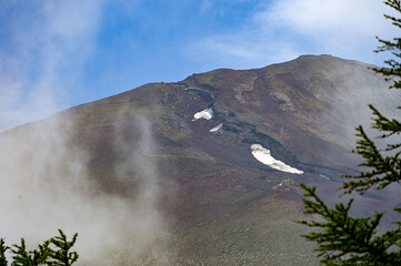 fifth station on mount fuji, view on the top with some clouds, japan