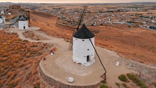 Aerial view of the windmills of Consuegra at sunset, Castilla-La Mancha, Spain.