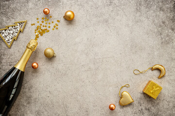 Christmas and New Year festive flat lay with champagne bottle and decoration, top view