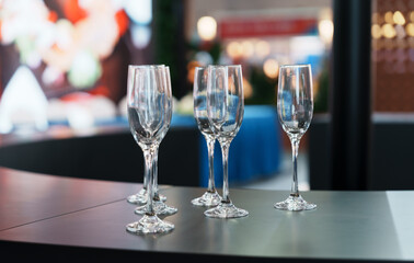Empty champagne glasses arranged on the bar