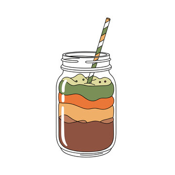 Layered smoothie in mason jar with striped straw  