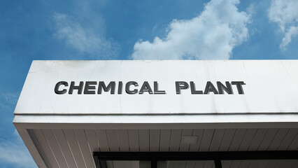 Chemical Plant word sign displayed on a building under a clear blue sky, representing industrial production, chemical manufacturing, research, and factory facilities