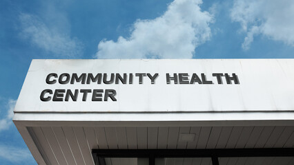 A hand deposits a coin into a glass jar featuring a yellow sticky note with the word Refund, symbolizing money return, financial reimbursement, getting cash back, and recovered funds