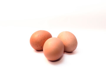 Three fresh eggs on white