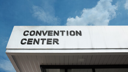 Convention Center word sign displayed on a building under a clear blue sky, representing events, conferences, exhibitions, meetings, and large-scale public or business gatherings