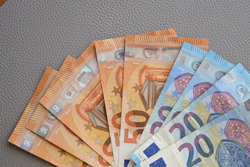 Black partmone with euro money. Paper bills in leather wallet for commerce concept.