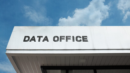 Data Office word sign on a building under a clear blue sky, representing technology, IT, data management, networking, digital services, and business operations