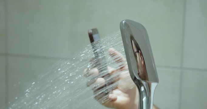 A person using a smartphone while showering, illustrating smartphone and TikTok addiction in everyday life.