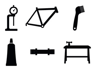 Fototapeta premium Silhouettes of bicycle tools and components on dark background