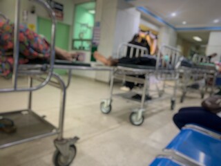 Patient lying on a wheelchair in a hospital