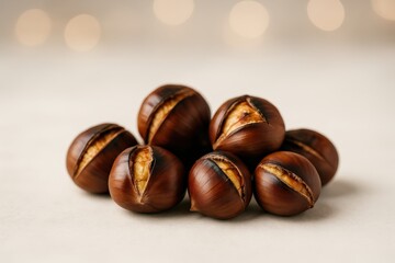 Obraz premium Roasted chestnuts arranged naturally evoking warmth and comfort with soft background lights highlighting their rich texture and culinary significance in seasonal festivities