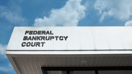 Federal Bankruptcy Court sign displayed on a building against a clear blue sky, symbolizing judicial system, insolvency, debt resolution, finance, and legal administration