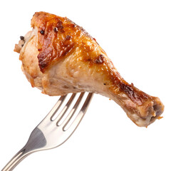 Deliciously roasted chicken leg on fork close-up