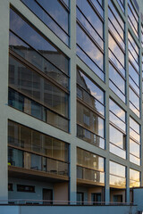 Modern residential buildings in Finland featuring glazed balconies. Urban housing architecture with glass structures and functional, clean Nordic design, urban living, modern construction techniques