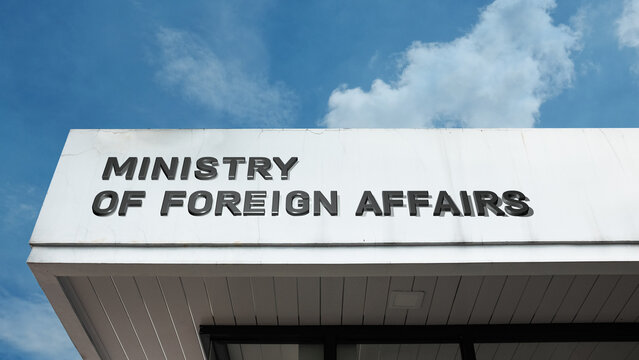 Ministry of Foreign Affairs sign on a building against a clear blue sky, symbolizing international relations, diplomacy, national policy, global affairs, representation, and authority