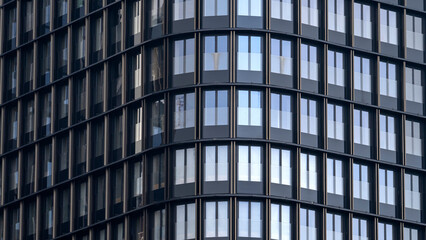 A breathtaking architectural masterpiece with a sleek and eye-catching glass exterior. High quality photo