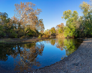Scenic view of the Big River reflecting colorful autumn foliage in St. Francois State Park in Bonne Terre, MO