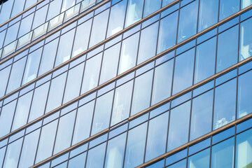 A breathtaking architectural masterpiece with a sleek and eye-catching glass exterior. High quality photo