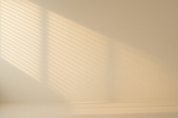 Soft afternoon sunlight casting linear shadows through blinds on a minimalist beige wall background