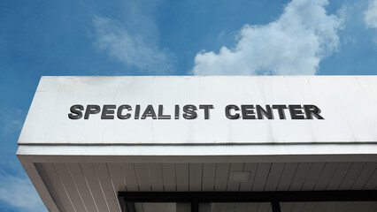 Specialist Center word signage on a professional or technical building under a blue sky, symbolizing expert services, focused care, consulting, technology, specialized medicine, professional practice