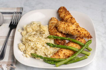 chicken tenders with asparagus and mashed  potatoes