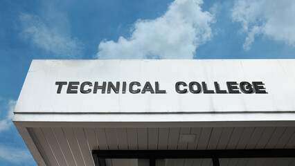 Technical College word signage on a higher education or institutional building under a blue sky, symbolizing applied science, vocational training, technology, career readiness, skill development