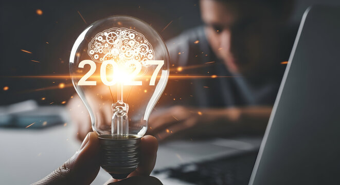 Illuminated Light Bulb with Brain and Numbers 2027 Symbolizing Innovation and Future Ideas.
