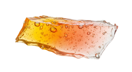 Translucent amber candy bark with trapped air bubbles isolated against a white backdrop offering a textured and colorful treat