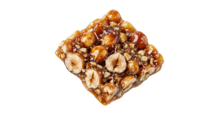 Hazelnut brittle square with caramelized texture against a plain background, ideal for desserts and sweet snacks showcasing confectionary creations