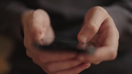 Female hands holding modern smartphone, with fingers scrolling through screen, representing digital communication, internet connectivity, and mobile device usage in daily life, close-up, slow motion.