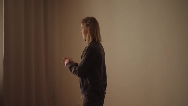 Side view of woman with cerebral palsy focused on arm rehabilitation exercises in physical therapy, improving coordination, strength and motor skills with determination techniques, slow motion.