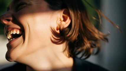 Close-up of a joyful woman with closed eyes laughing heartily in the sunlight, expressing pure happiness and genuine emotion.