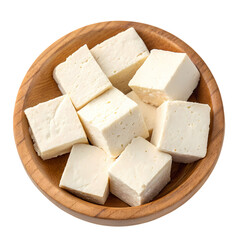 Fresh paneer cheese cubes in wooden bowl closeup