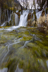 The  Arrow Bamboo Lake Waterfall in Jiuzhaigou National Park is a famous tourist attraction in Sichuan, especially during the autumn leaves season, China