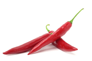 Fresh red chili peppers stacked together. isolated on white background.