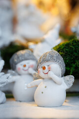 Cute snowman figurines with silver hats and wings for Christmas decor