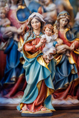 Colorful Madonna and Child Figurine in Nativity Scene Display