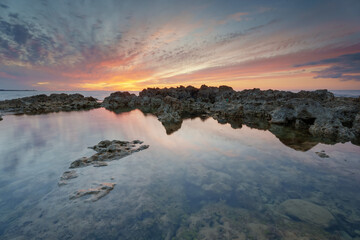 Beautiful seascape and water reflection at the sunset