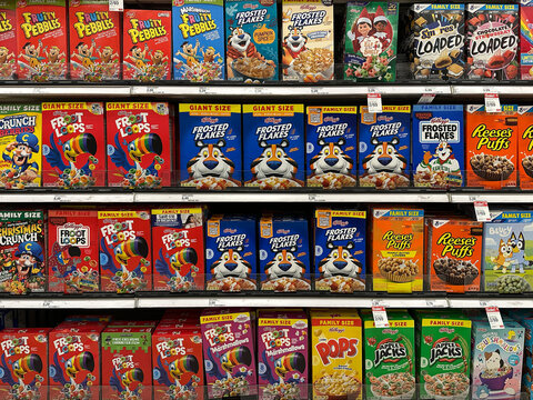 Northville, Michigan, USA - Nov 16, 2025 : A grocery aisle filled with Kelloggs Froot Loops, Frosted Flakes,and other popular brands, arranged in bright, eye-catching rows across the shelves.