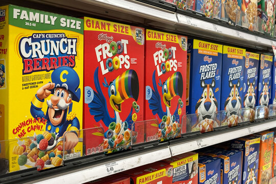 Northville, Michigan, USA - Nov 16, 2025 : A grocery aisle filled with Kelloggs Froot Loops, Frosted Flakes,and other popular brands, arranged in bright, eye-catching rows across the shelves.