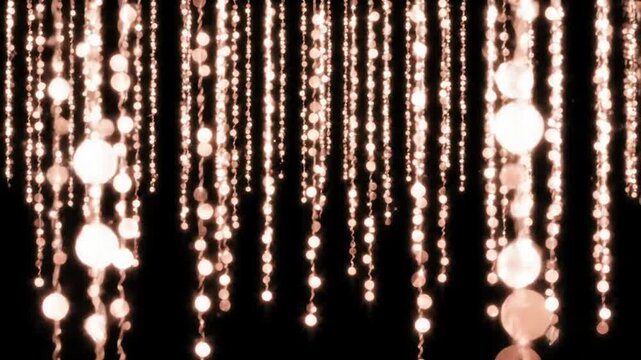 Dazzling rose gold string lights create an elegant festive backdrop on black.