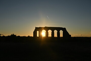 roman aqueduct at sunset