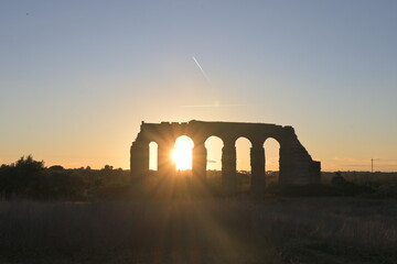 roman aqueduct at sunset
