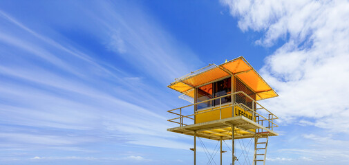 Iconic Yellow Lifeguard Tower on Gold Coast Beach in Australia: Summer Safety Landmark
