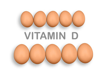 Chicken eggs on the white background with word VITAMIN D. Eggs are one of the most nutritious and versatile foods in the world