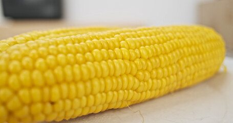 Boiled sweet corn, side-view, close-up