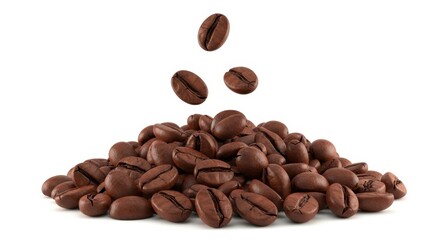 Roasted coffee beans in a pile falling into the heap of fresh coffee ingredients