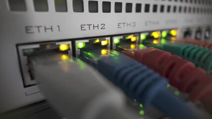 Closeup video of professional network router with active ethernet ports and blinking LED indicators, showcasing data connectivity and infrastructure - Powered by Adobe